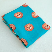 Organic muslin lion swaddle blanket folded. 
