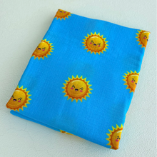 Organic muslin sun swaddle blanket folded.