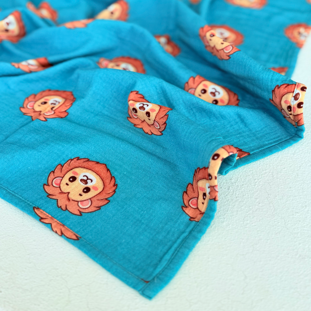 High contrast lion face print on muslin swaddle.  