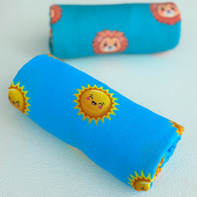 Rolled organic muslin sun swaddle blanket. 
